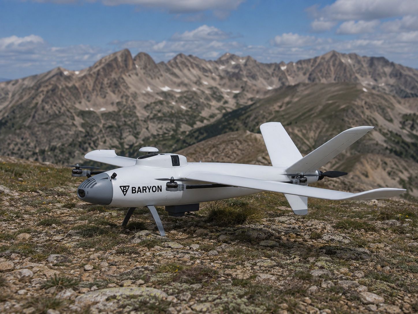 Concept render: Baryon Aerial Scout VTOL survey aircraft on an alpine ridgeline